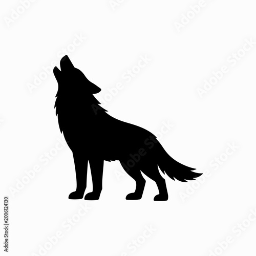 Howling black silhouette wolf standing