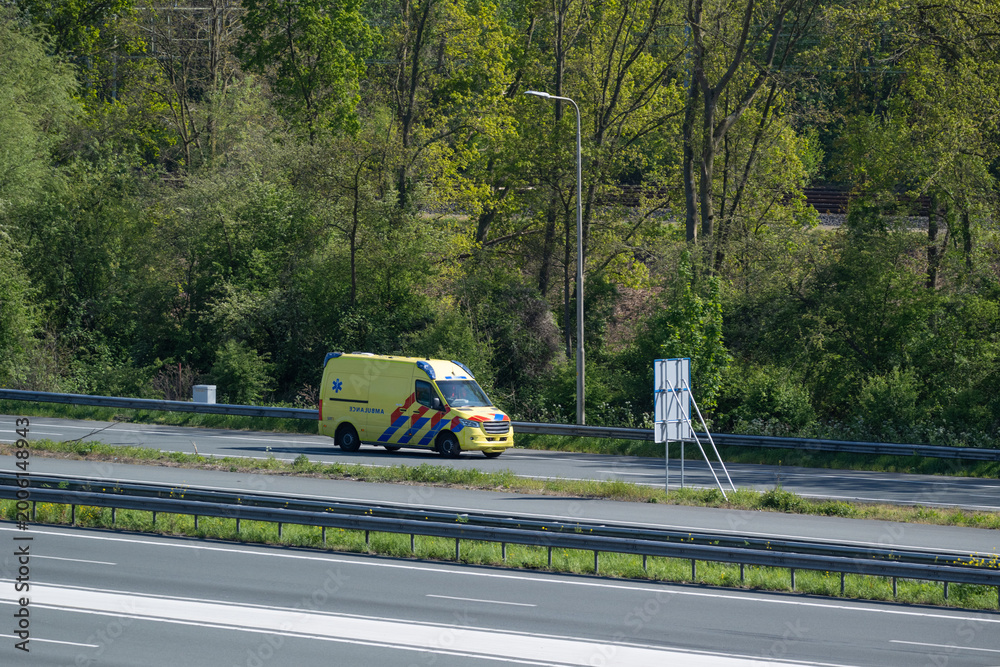 Fototapeta premium Ambulance Driving on Highway