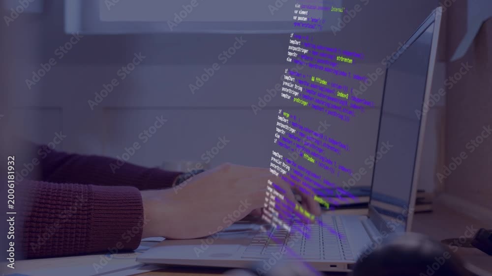 Developer typing with hands on laptop keys causing color code overlay ...