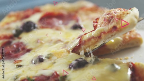 Spatula initiating lift, pizza slice rising with cheese stretching and snapping to showcase texture