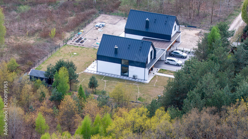 Принти на полотні Newly built passive semi-detached family house with shared garage, aerial drone view