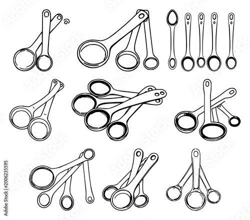 Foto Measuring spoons set with black line art against white background featuring kitc