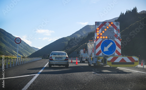 Roadworks at Transmission Gully. Traffic management vehicle with flashing arrow board directing traffic. Wellington Region.