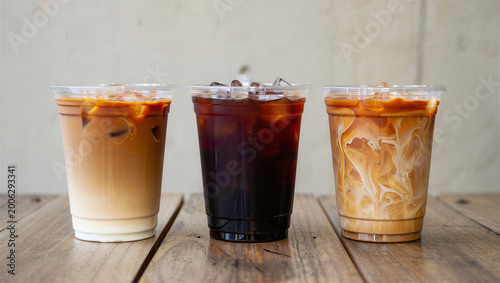 Obraz na płótnie Three iced coffee drinks with various layers of milk and coffee in clear plastic