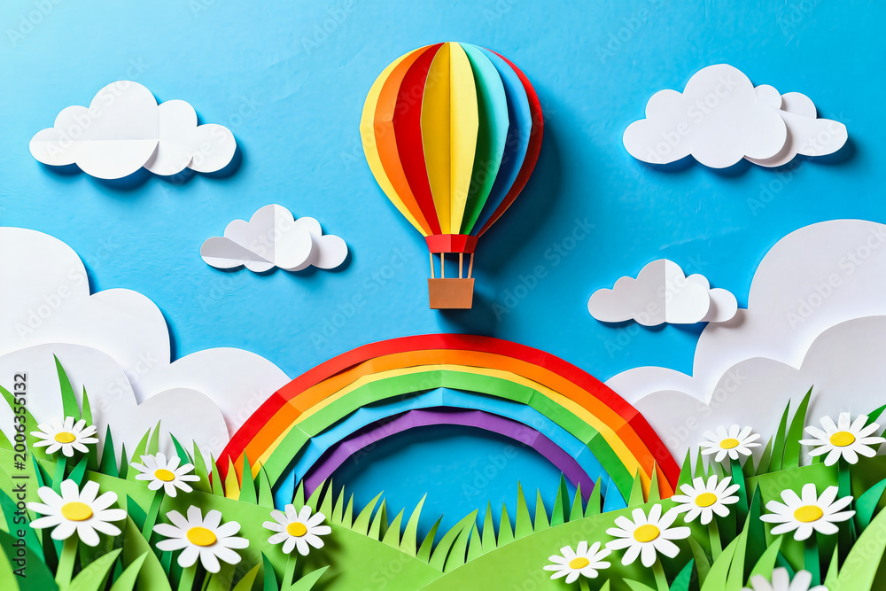 Fototapeta premium A top-down paper craft illustration featuring a rainbow hot air balloon over a floral meadow, rainbow, clouds and bright blue sky.