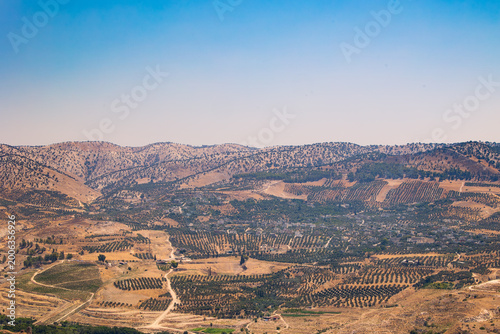Cuadro en lienzo Horizontal high angle wide shot of the arid mountainous border landscape between