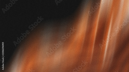 фотографія Abstract warm amber light rays blurring over dark textured background for artist