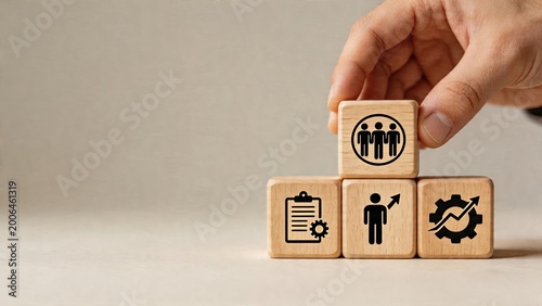 Business management strategy concept wooden cubes with team work growth gears and planning icons arranged pyramid shape for organizational structure improvement project development