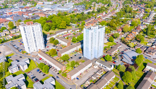 Aerial view of social council housing in a low cost area of the UK with two high rise tower blocks of flats