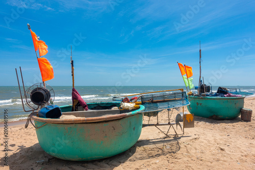 Large, motorized basket boats – used for inshore fishing – are brought ashore by fishermen from Phuoc Hai village, Ba Ria - Vung Tau, after returning from their fishing trips.