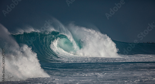 Huge waves crashing in the ocean. Seascape environment background. Water texture with foam and splashes. Hawaiian surfing spots with nobody