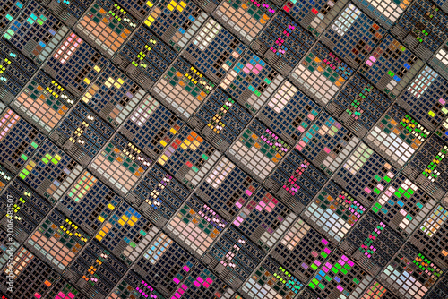 Silicon semiconductor wafer with integrated circuit die mosaic pattern.