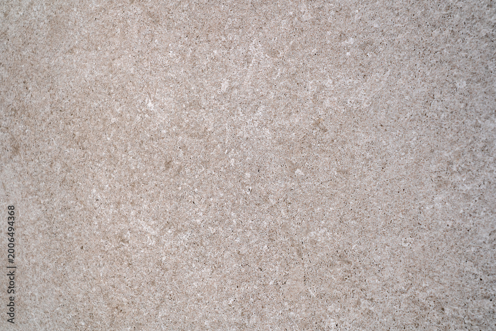 Fototapeta premium Beige stone texture with fine grain and subtle natural pattern, minimal neutral background for modern interior design and architectural surfaces