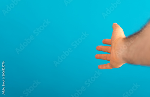 Hand reaching out toward bl...