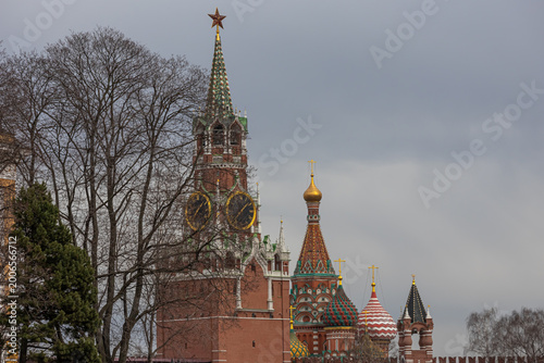 St. Basil's Cathedral and the Spasskaya Tower on Red Square. The Spasskaya tower with chimes. The Moscow Kremlin and historical buildings. Cultural heritage of Russia.