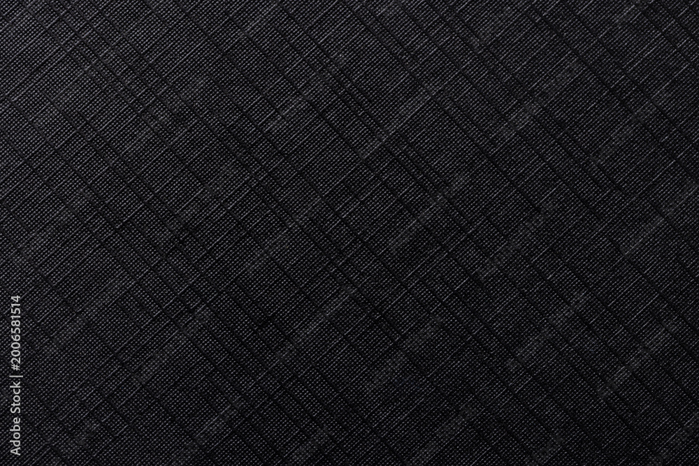 Fototapeta premium Black Grid Fabric Texture Background with Fine Ribbed Pattern,Macro,High-resolution macro shot of a black synthetic fabric featuring a detailed horizontal ribbed pattern and subtle grid texture.