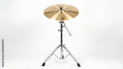 A single brass cymbal on a tripod stand, ready for musical performance on a white background