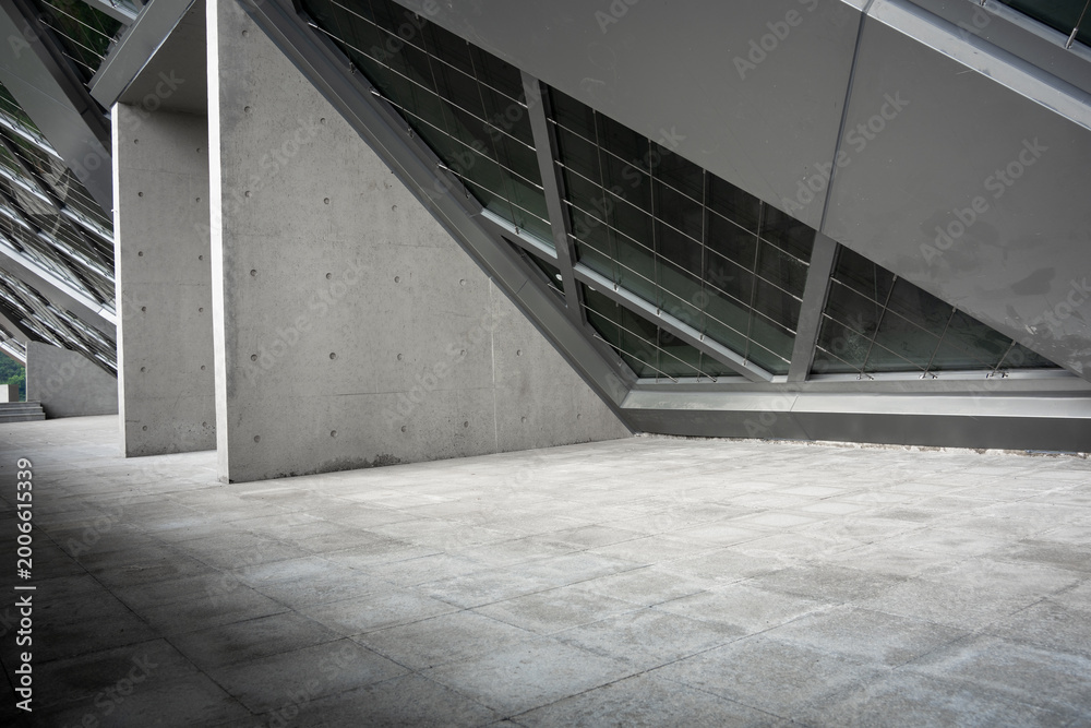 Fototapeta premium Interior space of modern architecture featuring concrete structural elements and geometric design