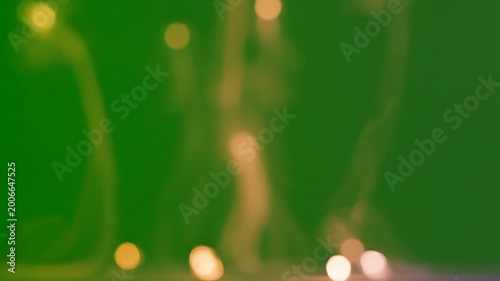 Blurry lights on green background.