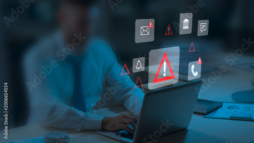 Cybersecurity Warning on Mobile Phone Showing Alert Messages and Phishing Scams Targeting Email, Bank, and Personal Data. Online Safety and Data Protection While Using Smartphone and Laptop at Home.