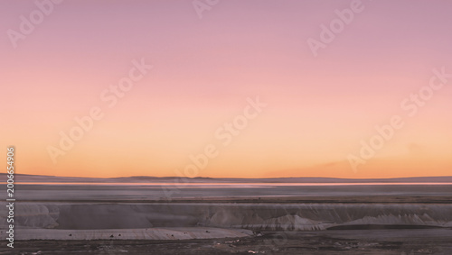 Minimal landscape with horizon and sunrise gradient sky, soft colors, modern nature background, no people
