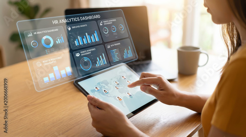 HR analytics tech saas platform corporate professional using digital tablet for human resources data management and global employee performance tracking with futuristic dashboard interface in office