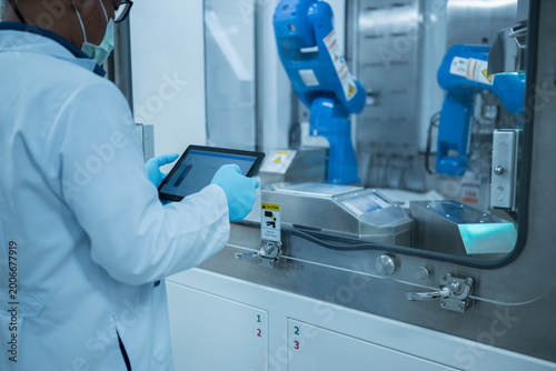 Medical engineer test robot for chemotherapy drug compounding in development laboratory of engineers.Hihg technology pharmaceutical production vaccine concept.New innovation.Medical technology concept