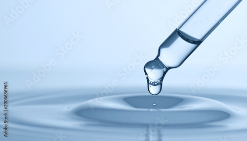 Serum drop: Capturing the elegance of a single water droplet descending from a pipette into a rippling surface, symbolizing purity and fluidity. A visual symphony of clean, essential.