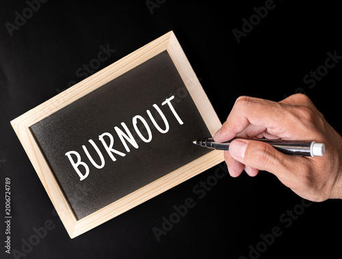 Fotografie Burnout text on black chalkboard, mental health workplace stress concept