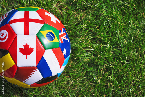 Obraz na plátně a soccer ball with various national flags on the soccer stadium