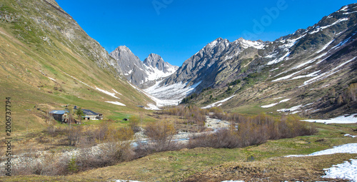 beautiful landscape in French Alps in spring with rocky peak mountains in bac...