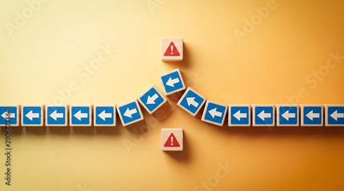Obraz na plátně Wooden blocks with arrows and warning signs on yellow background symbolizing cha