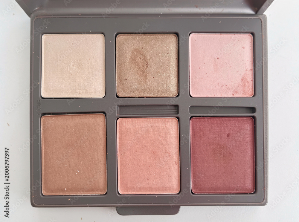 Fototapeta premium A detailed view of a colorful makeup palette with various shades and products