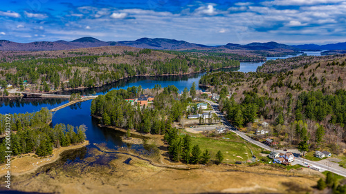 Tablou pe pânză Long Lake, NY, USA  April 29, 2026  Aerial photograph captures the scenic hamlet of Long Lake and Raquette River in the heart of New York's Adirondack Mountains