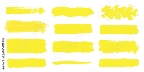 Foto Set of yellow paint brush strokes and ink textures for creative design projects