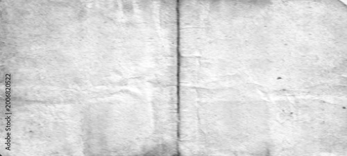 Foto Light grey textured paper with center vertical fold line and faint horizontal creases for minimalist background or vintage stationery designs needing clean and subtle aged appearance for layout art