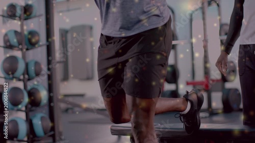 Client stepping on bench doing split-squat with bar camera panning sparkle showing legs for fitness