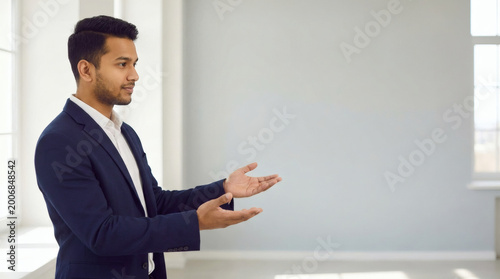 holding, businessman, business, paper, blank, sign, card, showing, people, board, person, hand, suit, banner, advertisement, smile, message, handsome, billboard, guy, advertise, copyspace, space, empt