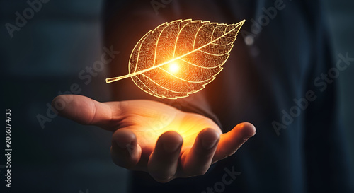 Glowing digital leaf icon representing sustainable technology held by a hand to symbolize the future of green energy innovation and environmental responsibility in modern business