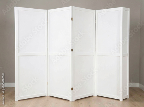 A simple wooden room divider on a wooden floor