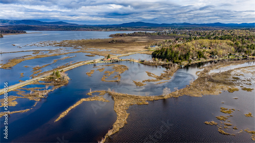 Εκτύπωση καμβά Tupper Lake, NY, USA - April 29, 2026  Aerial photo captures the Raquette river and surrounding wetlands of Tupper Lake in New York's Adirondack Mountains