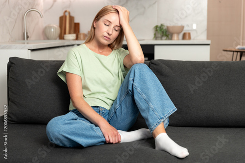 Tired woman having headache, suffering from mental disorder