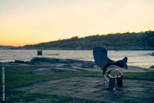 Whale Spring Rider on Empty Playground at Nordic Coastal Sunset