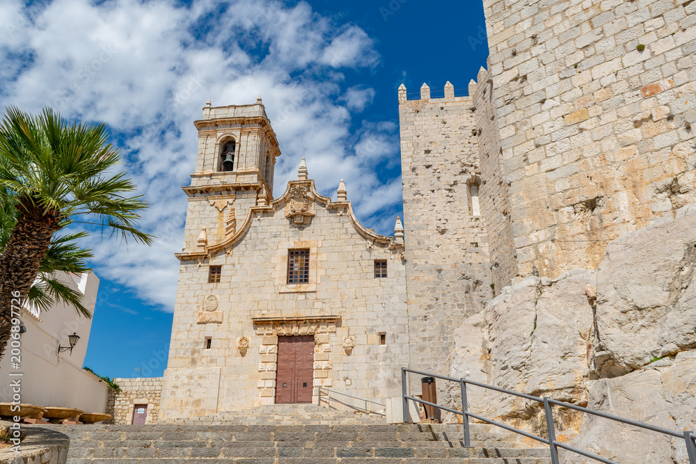 Fototapeta premium White colonial church bell tower blue sky Spanish town Spain