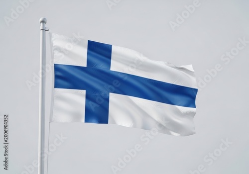 Flag of finland waving on a flagpole against a clear sky background, a nordic cross symbol representing the nations history and natural beauty