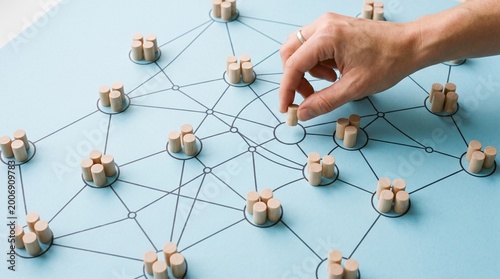 Social media networking. Network with members connected with each other. Group of people. Communication, teamwork, community, society. Abstract concept with wooden pieces on blue background.