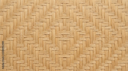 Woven bamboo texture with repeating geometric pattern in natural light brown color