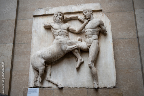 Obraz na płótnie London, UK - 4 Jul 24: Ancient Greek centaur combat relief, British Museum Londo