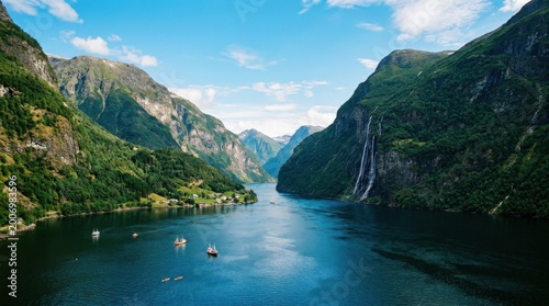 Breathtaking Norwegian Fjord Landscape with Majestic Mountains and Cascading Waterfalls.