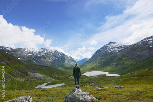 Obraz na plátně Back, hiking and woman outdoor with mountain view, adventure and exploration with space in winter